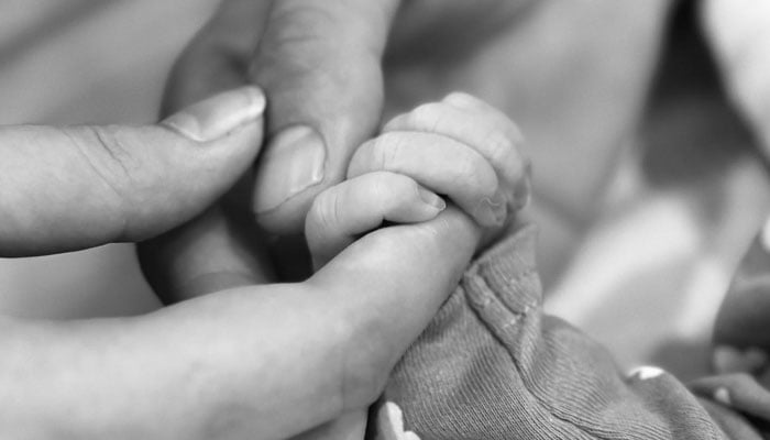 This images shows Pakistani pacer Shaheen Shah Afridi, his wife Ansha holding their newborn son Aliyaas hand. — Instagram/@ishaheenafridi10