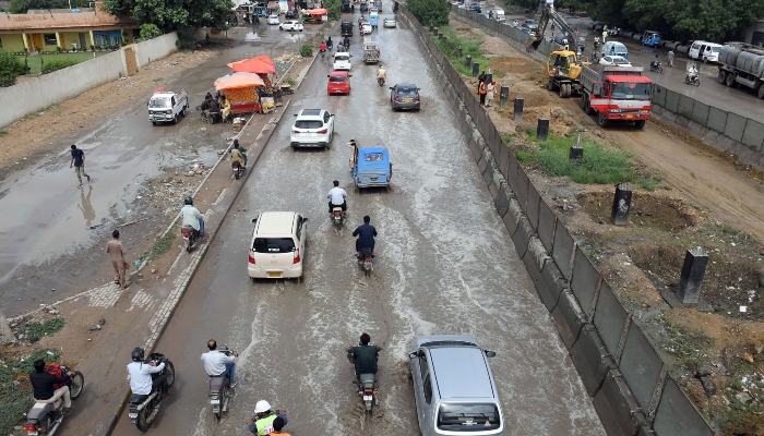 People are facing troubles due to accumulated rainwater on University Road in Karachi on August 20, 2024. —Online