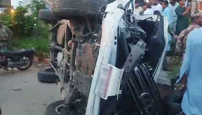 A damaged vehicle is lying upside down due to an accident on Karsaz Road in Karachi on August 19, 2024. — Reporter