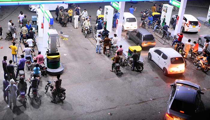 A view of large number of motorcyclist filling fuel from PSO petrol pump in Hyderabad on July 2, 2022. — APP