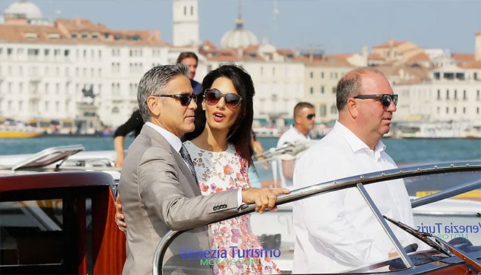 George Clooney and Amal Clooney enjoy a day out with twins.