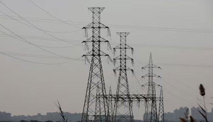 A representational image showing a power transmission tower in Karachi. — Reuters/File