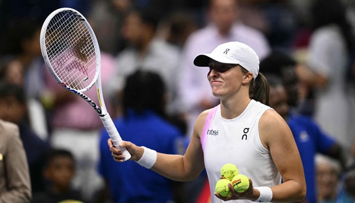 Poland’s Iga Swiatek smiles after defeating Russia’s Liudmila Samsonova during their women’s singles round of 16 match on day eight of the US Open tennis tournament at the USTA Billie Jean King National Tennis Center in New York City, on September 2, 2024. — AFP