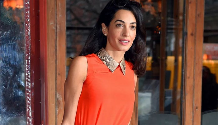 Amal Clooney leaves Venice with George following Wolfs movie backlash.