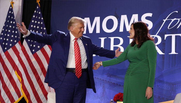 Republican presidential nominee, former US President Donald Trump (left) and Co-founder of Moms for Liberty Tiffany Justice (right) share a moment during the 2024 Joyful Warriors National Summit on August 30, 2024 in Washington, DC.— AFP