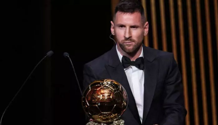 Lionel Messi poses for a photo while holding Ballon dOr trophy. — AFP/File