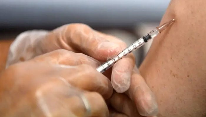 This August 10, 2022 file sphoto shows a pharmacist administering a dose of Imvanex, a vaccine to protect against mpox virus, at a pharmacy in Lille, northern France. — AFP