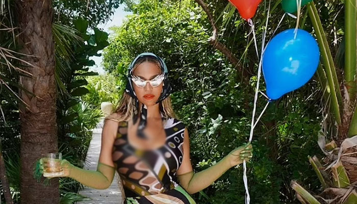 Beyoncé dazzles in mini dress for beach celebration.