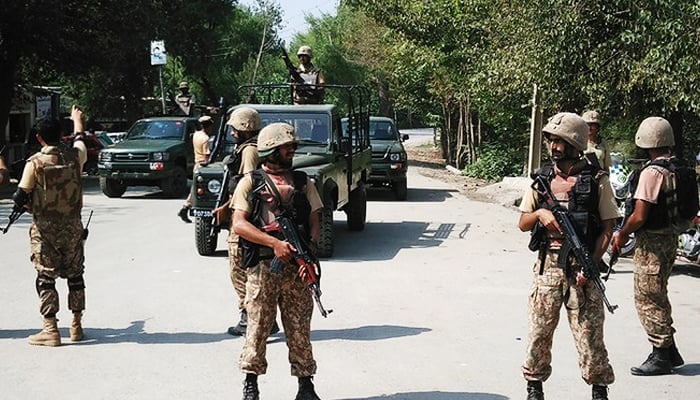 In this representational file photo, Pakistani soldiers cordon off a street leading to the outskirts of Peshawar on September 2, 2016. — AFP