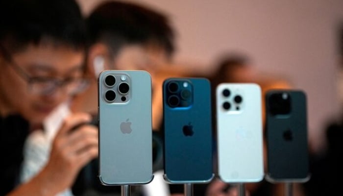 People look at the new iPhone 15 Pro at an Apple store in Shanghai, China, on September 22, 2023. —Reuters