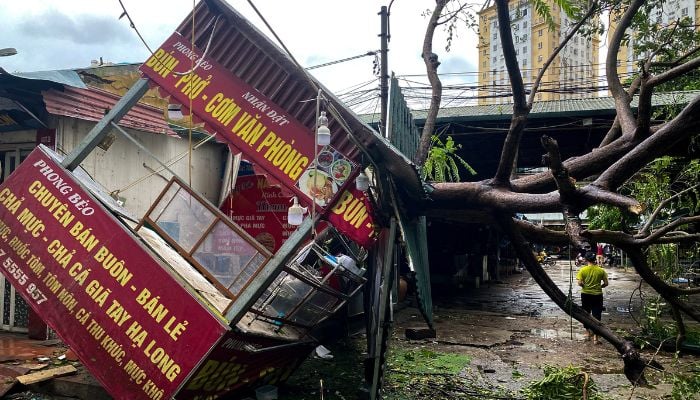 A man walks past a devastated area following the impact of Typhoon Yagi, in Hanoi, Vietnam on September 8, 2024. — Reuters