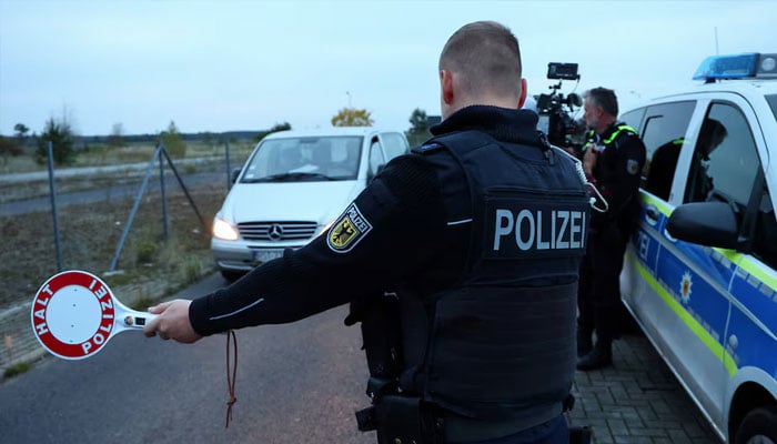 A German federal police Bundespolizei officers stops a vehicle during a patrol along the German-Polish border to prevent illegal migration near Forst, Germany, October 12, 2023. — Reuters