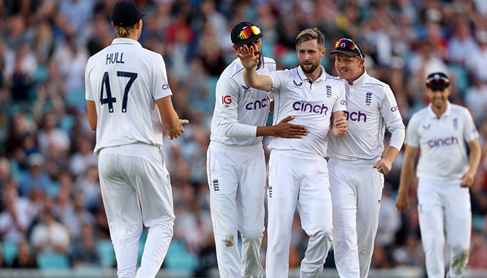 Englands Chris Woakes celebrates after taking the wicket of Sri Lankas Dimuth Karunaratne during third Test match between England and Sri Lanka at The Oval, London, September 8, 2024. — Reuters