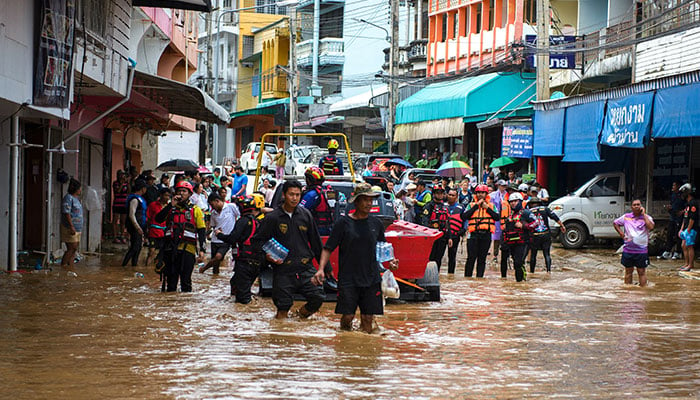 Rescue workers help stranded people from a flooded area at the border town of Mae Sai, following the impact of Typhoon Yagi, in the northern province of Chiang Rai, Thailand on September 11, 2024. — Reuters