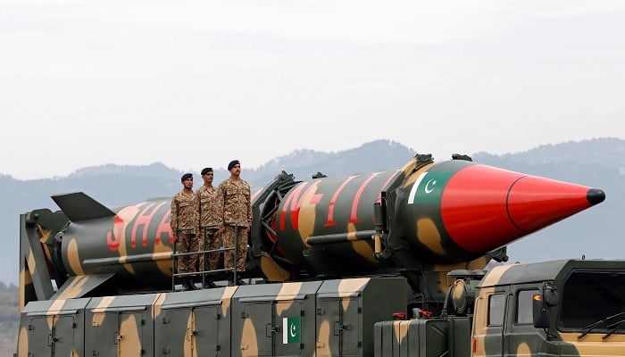 Military personnel stand beside a Shaheen III surface-to-surface ballistic missile during Pakistan Day military parade in Islamabad, Pakistan March 23, 2019.— Reuters