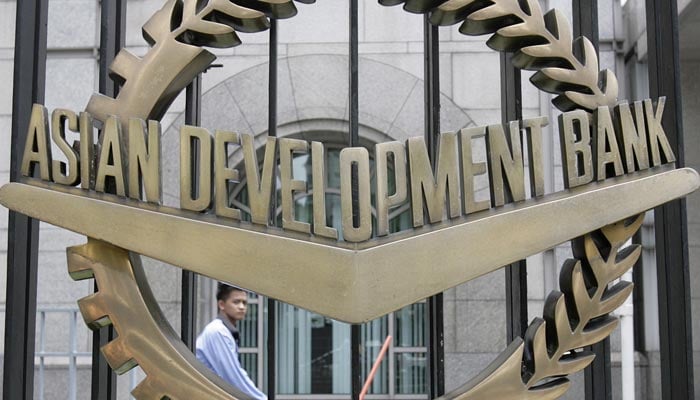 A worker walks past inside the Asian Development Bank (ADB) headquarters in Manila June 17, 2009. — Reuters