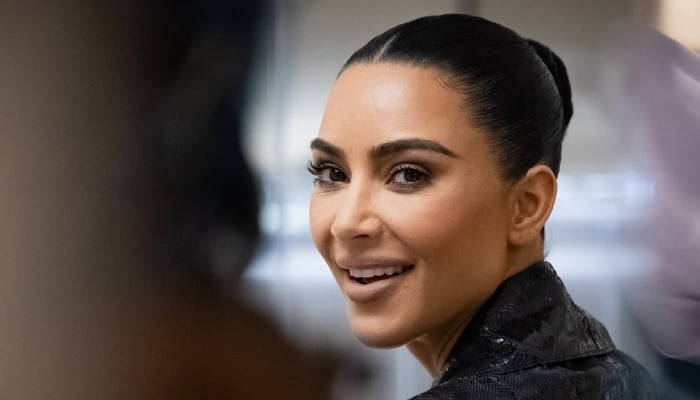 Kim Kardashian shares backache remedy with jaw-dropping selfies