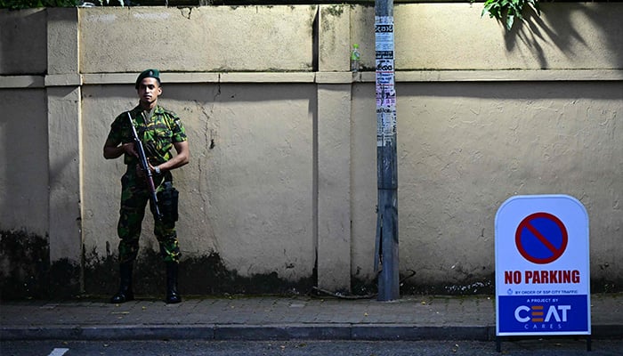 A security personnel stands guard outside a counting centre at the end of voting in Sri Lankas presidential election in Colombo on September 21, 2024. — AFP