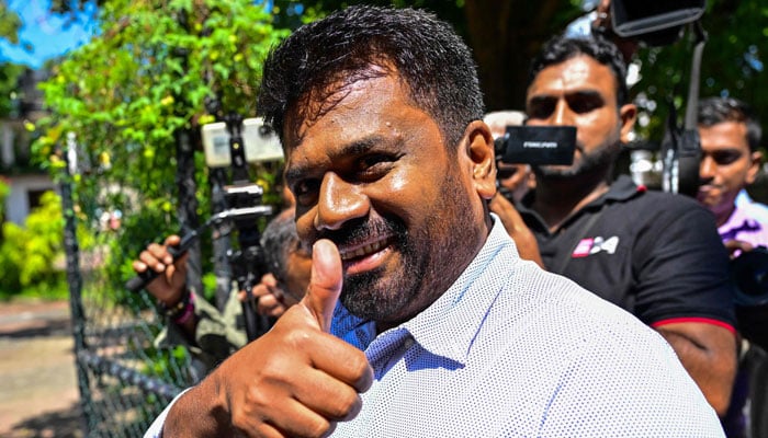 National Peoples Power (NPP) partys presidential candidate Anura Kumara Dissanayaka arrives at a polling station to cast his ballot during voting in Sri Lanka´s presidential election in Colombo on September 21, 2024. — AFP