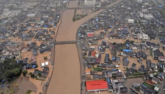 An aerial view taken by a helicopter shows a flooded residential area caused by torrential rain in Wajima, Ishikawa Prefecture, Japan, on September 21, 2024. —Reuters