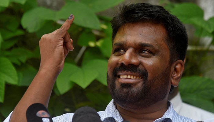 Anura Kumara Dissanayake, the presidential candidate from National Peoples Power, shows his ink-marked finger after casting his vote at a polling station, on the day of the presidential election, in Colombo, Sri Lanka on September 21, 2024. — Reuters