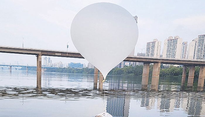 An unidentified object believed to be a North Korean trash-filled balloon, on the surface of the Han River. — AFP/File