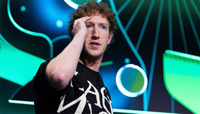 Metas CEO Mark Zuckerberg mimics virtual reality glasses during a live recording panel at Acquired, a technology podcast, at the Chase Center in San Francisco, California, US on September 10, 2024. — Reuters