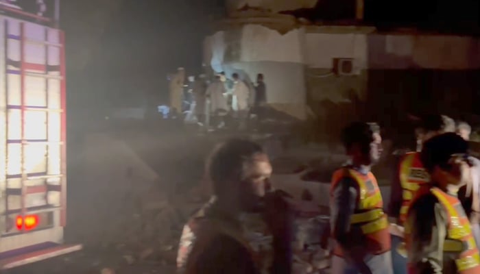 Rescue workers gather outside the police station in KP’s Swabi district following an explosion on September 26, 2024. — Screengrab via Geo News