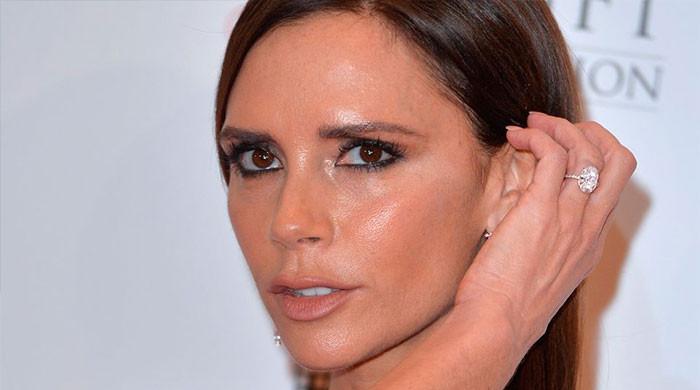 Victoria Beckham appears strained leaving Paris hotel ahead of Fashion Week