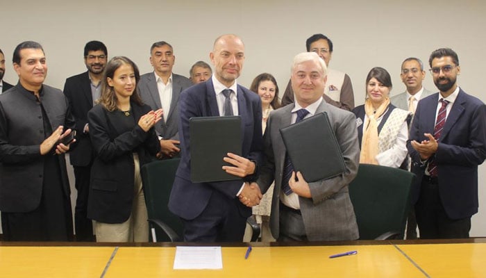 Denmarks Ambassador Jakob Linulf (left) shakes hands with AKF CEO Akhtar Iqbal after signing the SCRIP agreement in Islamabad on September 27, 2024. — PR