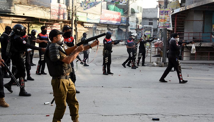 Punjab police personnel fire tear gas to disperse supporters PTI during protest at Iqbal road in Rawalpindi on September 28, 2024. — Online