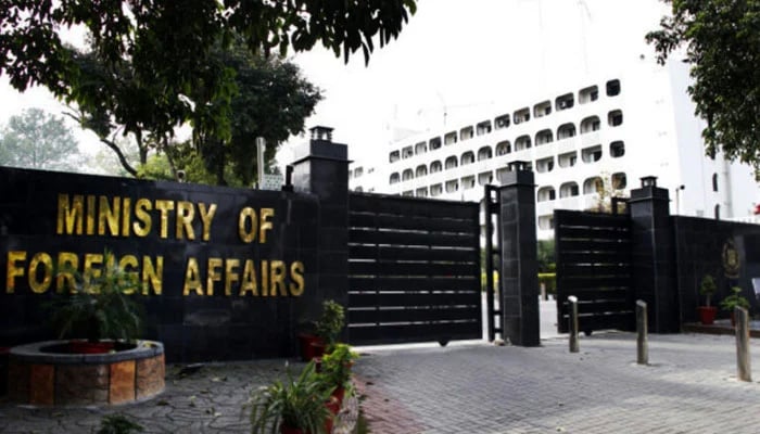 Two guards stand outside of the Ministry of Foreign Affairs office in Islamabad, Pakistan. — AFP/File