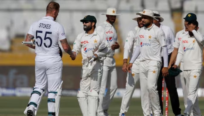 Englands Ben Stokes shakes hands with Pakistani wicketkeeper Mohammad Rizwan at the National Stadium Karachi on December 20, 2022. —Reuters