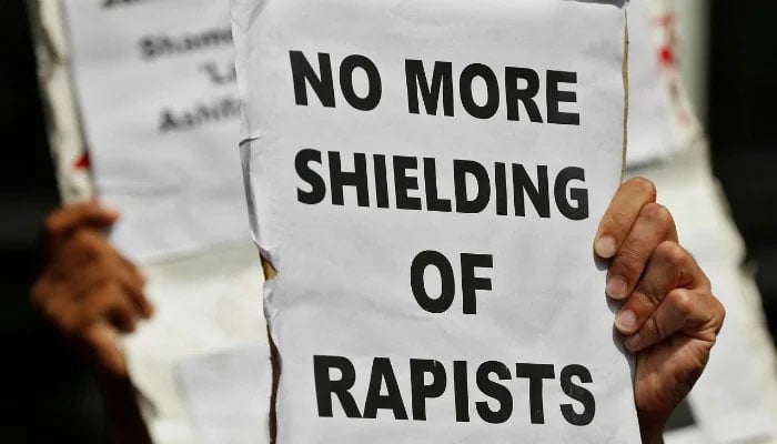 People hold placards at a protest against the rape of an eight-year-old girl, in Kathua, near Occupied Jammu and Kashmir in New Delhi, India April 12, 2018. — Reuters