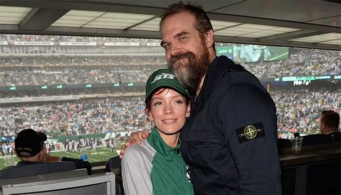 Lily Allen and David Harbour look smitten at New York Jets game.