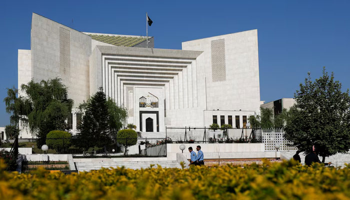 Police officers walk past the Supreme Court building in Islamabad. — Reuters/File