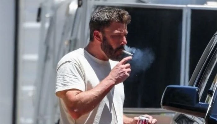 Ben Affleck sparks concerns as he smokes cigarette in luxury BMW