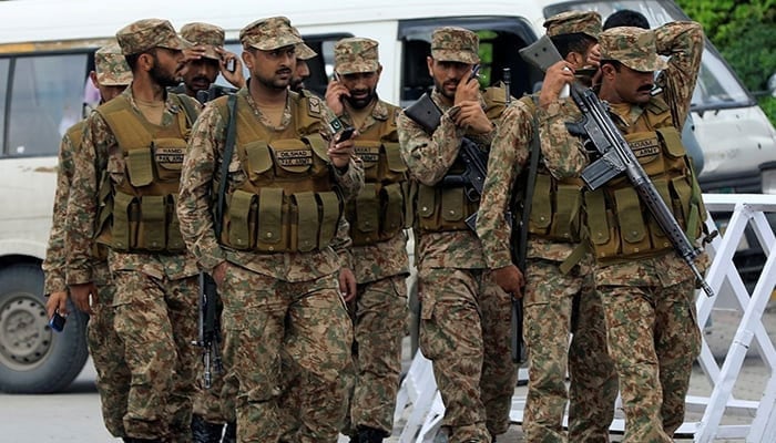 Pakistan Army soldiers arrive at the premises of the distribution point where electoral workers gather to collect election materials, ahead of the general election in Rawalpindi, on July 24, 2018. — Reuters