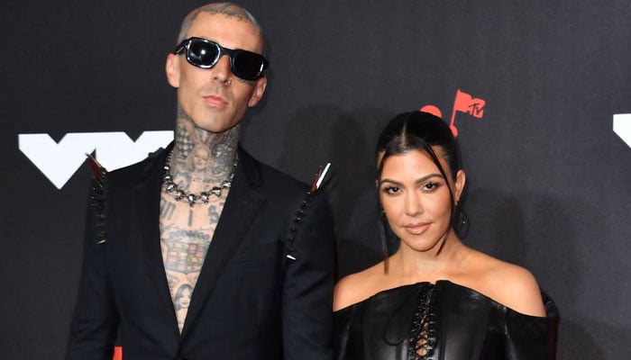 Kourtney Kardashian and Travis Barker opted for inflatable skeleton costumes for Halloween