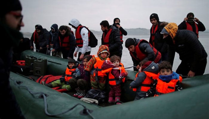 A representational picture shows a group of over 40 migrants with children get on an inflatable dinghy, as they leave the coast of northern France to cross the English Channel, near Wimereux, France, November 24, 2021. — Reuters