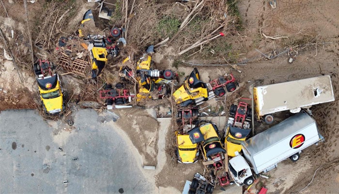 An aerial view of flood-damaged tractor trailers wrought by Hurricane Helene along the Swannanoa River in Asheville, North Carolina on October 4, 2024. — AFP