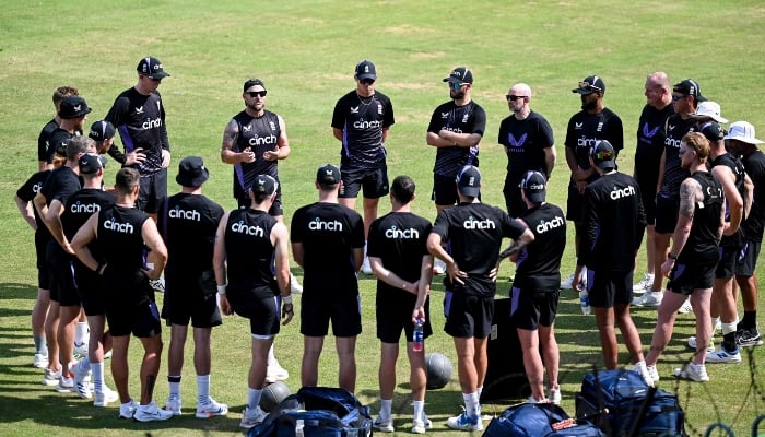 Englands head coach Brendon McCullum (back second left) gestures as he speaks to players during a practice session at the Multan Cricket Stadium in Multan on October 5, 2024. —AFP