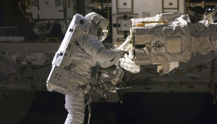 Astronaut Robert L Satcher Jr works outside the International Space Station (ISS) on November 19, 2009. — Reuters