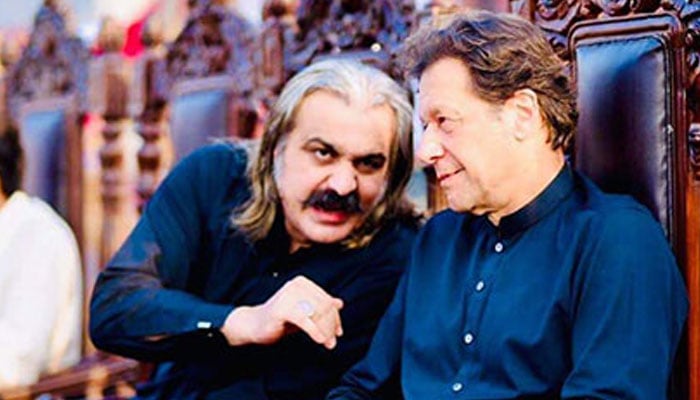 KP CM Ali Amin Gandapur (left) is seated with PTI founder Imran Khan in this photo shared by party. — Instagram/@ptiofficial