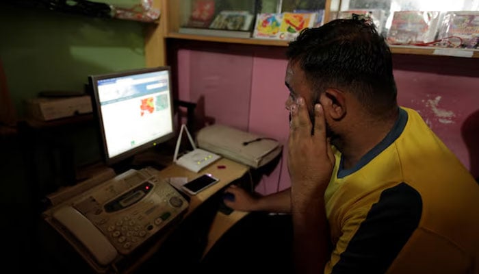 A man explores social media on a computer at an internet club in Islamabad, Pakistan, August 11, 2016. — Reuters