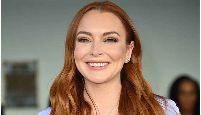 Lindsay Lohan flaunts her hairstyles inspired by her hit move The Parent Trap in new video.