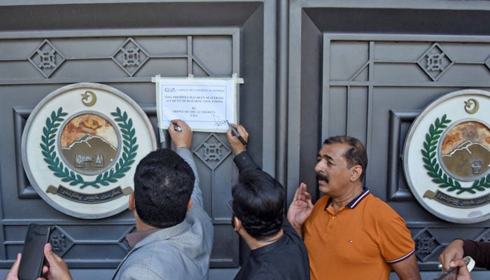 CDA officials seal the Khyber Pakhtunkhwa House in Islamabad on October 7, 2024. — Online