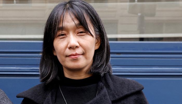 This photo taken on Nov 9, 2023 shows South Korean author Han Kang as she poses after co-winning the Medicis Prize for a foreign novel in Paris. — AFP