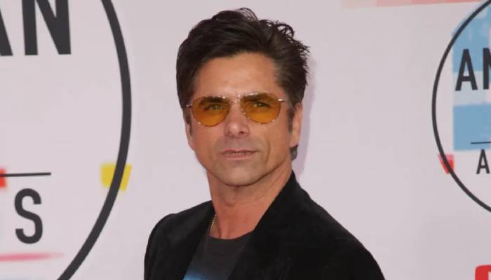 John Stamos has no qualms about sharing details in his new memoir