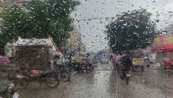 A representational image showing raindrops on a car window. — Geo.tv/File